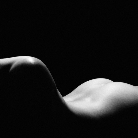black and white nude art photo of a woman's back and shoulders
