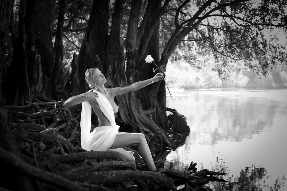 Black and white Art photo of goddess Artemis shooting her bow